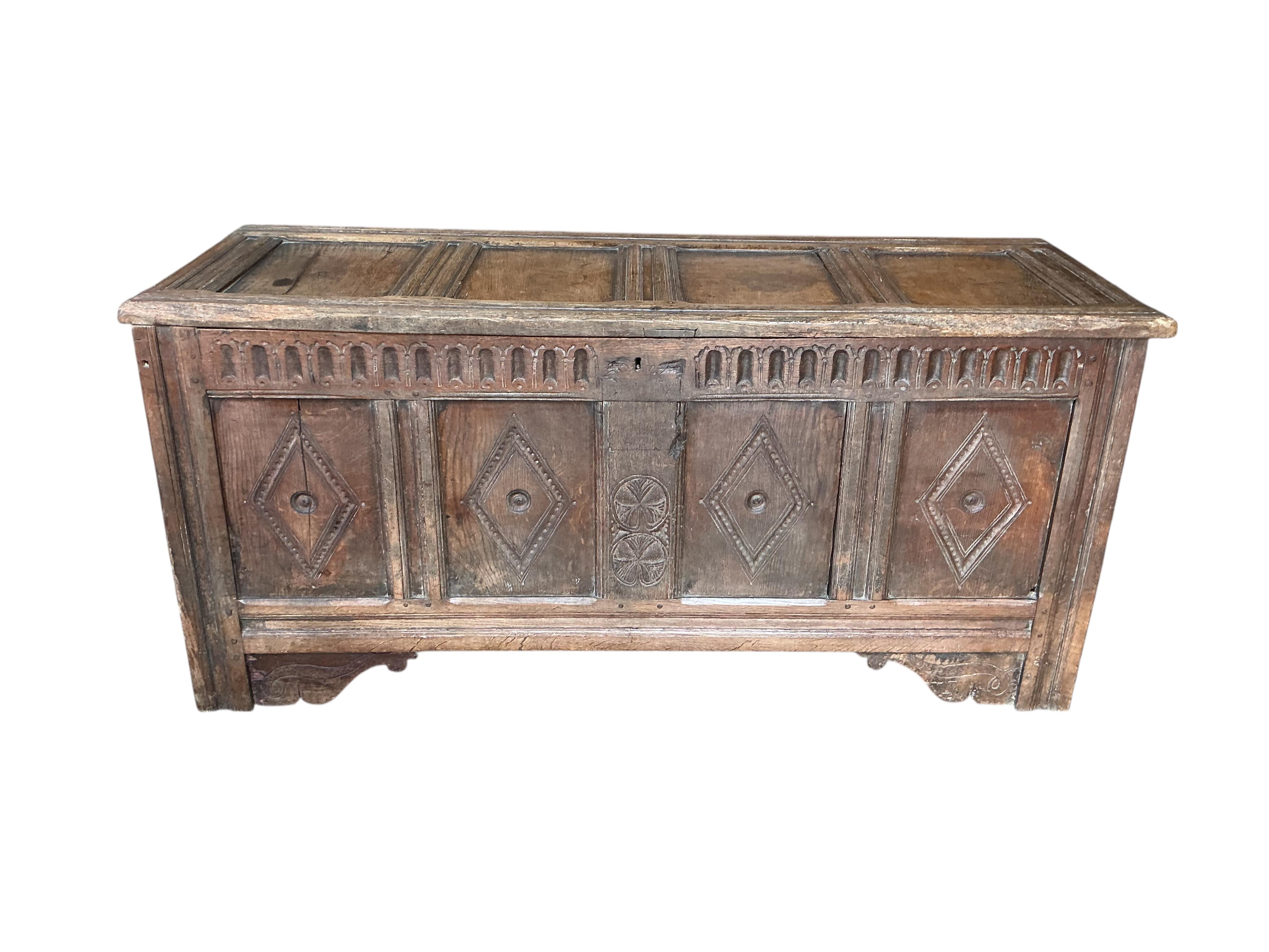 A carved oak coffer, width 146cm, depth 53cm, height 67cm